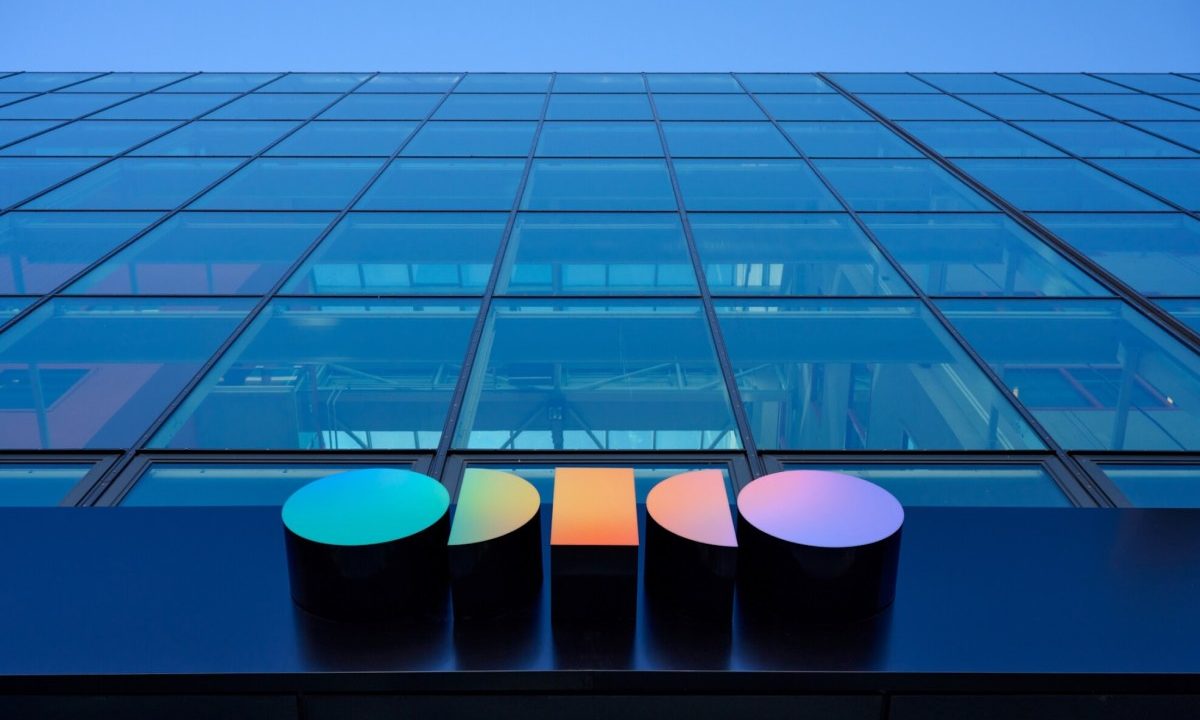 a photo of outside Odido's office, looking up at the building towards the sky