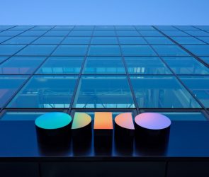 a photo of outside Odido's office, looking up at the building towards the sky
