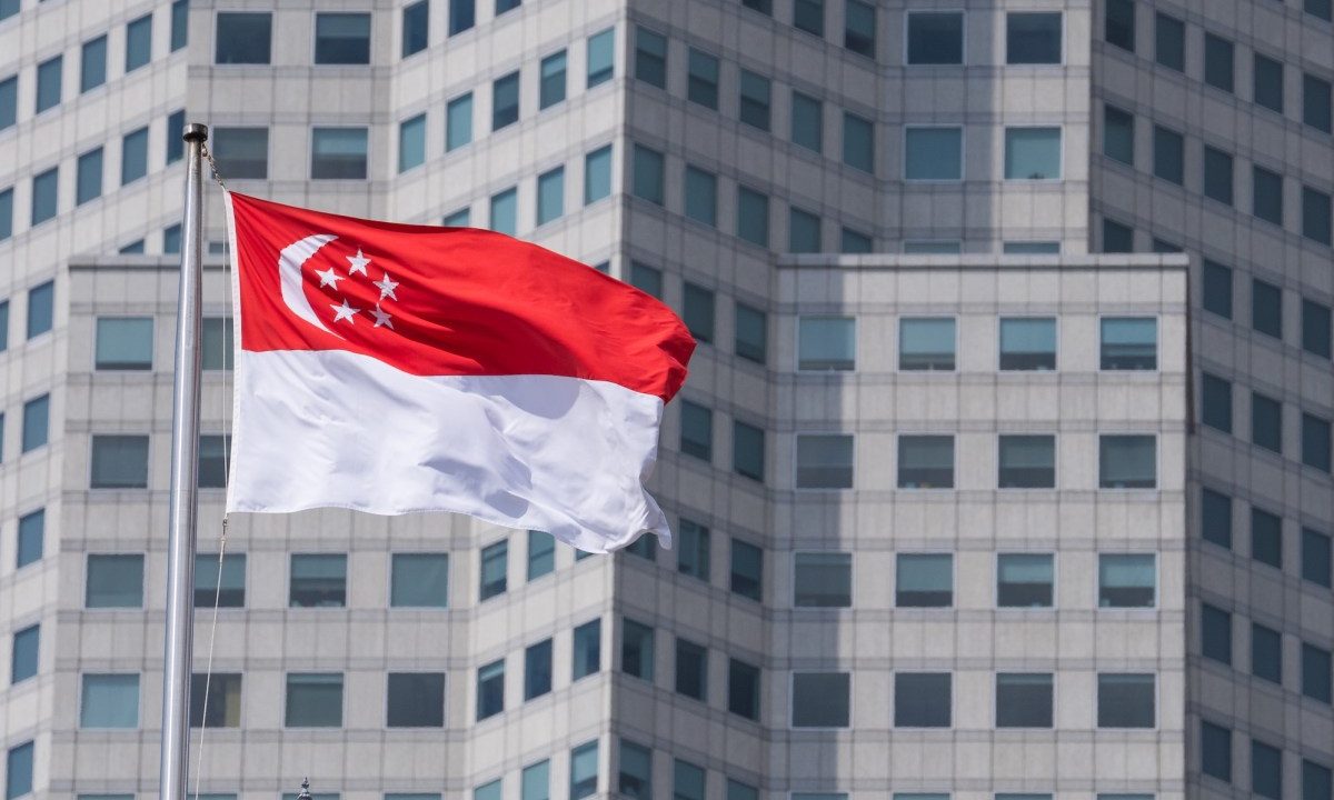 The Singapore flag on top of the parliament building ahead of incoming Prime Minister Lawrence Wong's swearing-in ceremony in Singapore, on Wednesday, May 15, 2024. Wong, Singapore's fourth prime minister since independence, will have to tackle rising cost-of-living concerns, balance US-China tensions and plan for an election after succeeding Lee Hsien Loong. Photographer: Nicky Loh/Bloomberg via Getty Images