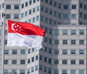 The Singapore flag on top of the parliament building ahead of incoming Prime Minister Lawrence Wong's swearing-in ceremony in Singapore, on Wednesday, May 15, 2024. Wong, Singapore's fourth prime minister since independence, will have to tackle rising cost-of-living concerns, balance US-China tensions and plan for an election after succeeding Lee Hsien Loong. Photographer: Nicky Loh/Bloomberg via Getty Images