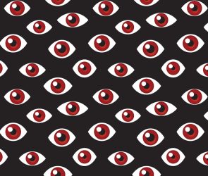 a pattern of red eyes on a darkened background