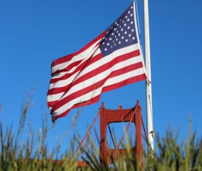 An American flag near the Golden Gate Bridge in San Francisco, California.
