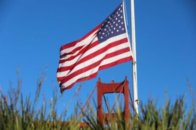 An American flag near the Golden Gate Bridge in San Francisco, California.