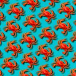 Red toy crab on blue background