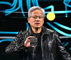 Jensen Huang holds up chip at CES 2025