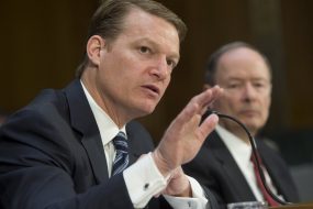 FireEye's chief executive testifying in Congress next to the former NSA director.