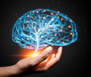 Hand Holding Glowing Brain