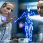 Physician And Patient Examine Holographic Body Models