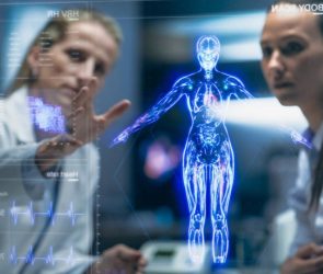Physician And Patient Examine Holographic Body Models