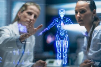 Physician And Patient Examine Holographic Body Models