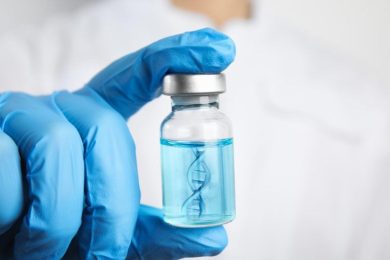 Scientist Holding DNA Strand Technology Vaccine Vial