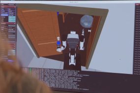 Software screenshot as virtual simulation data is driving the development of physical AI across corporate environments, led by initiatives like Ai2’s MolmoBot.