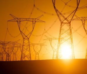 Silhouetted electricity pylon grid