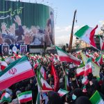 Demonstrators wave Iranian national flags as they gather for a rally in support of the new Supreme Leader at Enghelab Square in central Tehran on March 9, 2026. Iran marked the appointment of Ayatollah Mojtaba Khamenei to replace his father as Supreme Leader after Ayatollah Ali Khamenei was killed in joint U.S. and Israeli strikes on February 28.