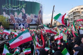 Demonstrators wave Iranian national flags as they gather for a rally in support of the new Supreme Leader at Enghelab Square in central Tehran on March 9, 2026. Iran marked the appointment of Ayatollah Mojtaba Khamenei to replace his father as Supreme Leader after Ayatollah Ali Khamenei was killed in joint U.S. and Israeli strikes on February 28.