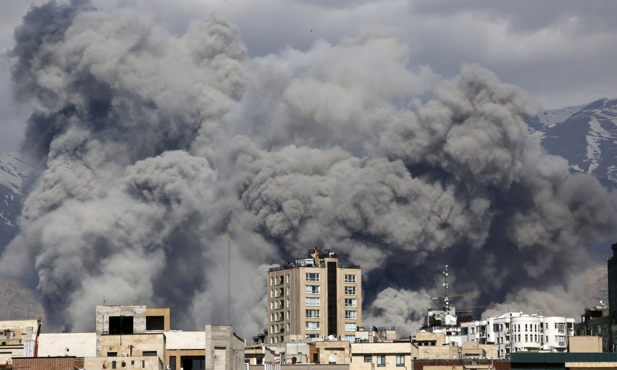 Smoke rises from the area after it was targeted in attacks as a series of explosions are heard in Tehran, Iran on March 01, 2026. The Islamic Republic of Iran Broadcasting (IRIB) building after Iranian authorities said it was targeted in the attacks.