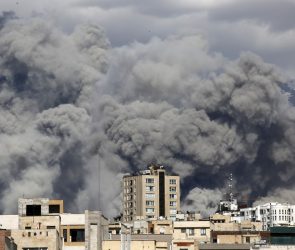 Smoke rises from the area after it was targeted in attacks as a series of explosions are heard in Tehran, Iran on March 01, 2026. The Islamic Republic of Iran Broadcasting (IRIB) building after Iranian authorities said it was targeted in the attacks.